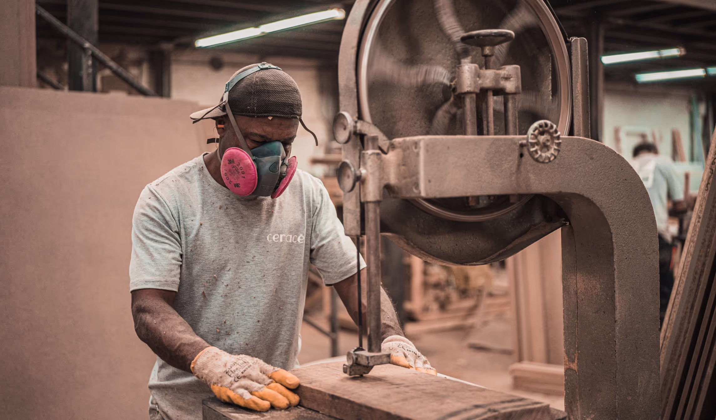 A team member working at a bandsaw